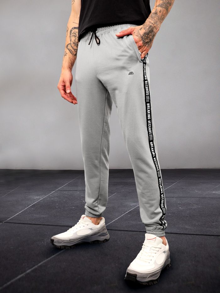 Nike grey tape joggers discount