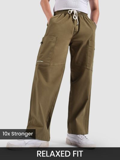a man wearing cotton blend cargo pants featuring flap pockets, 