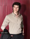 Man Wearing a clay beige &quot;satin shirt for men&quot; against a red background.