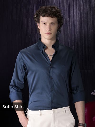 Navy Blue Satin Shirt Man wearing a navy satin shirt for men with rolled-up sleeves.