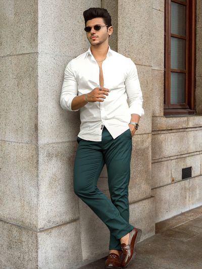 White shirt dark green pants top