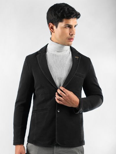 Black Single Breasted Blazer Man in a mens black blazer, with white turtleneck sweater, and grey trousers